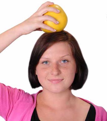 Girl Balancing Fruit on Head
